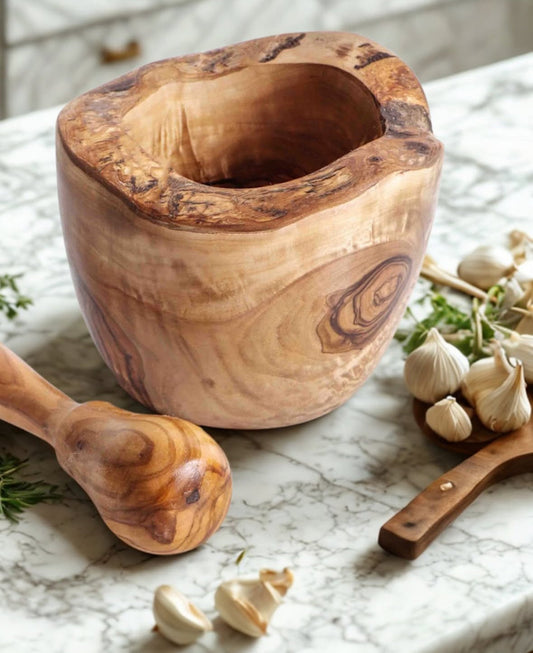 Solterra olive wood mortar and pestle styled with garlic and herbs